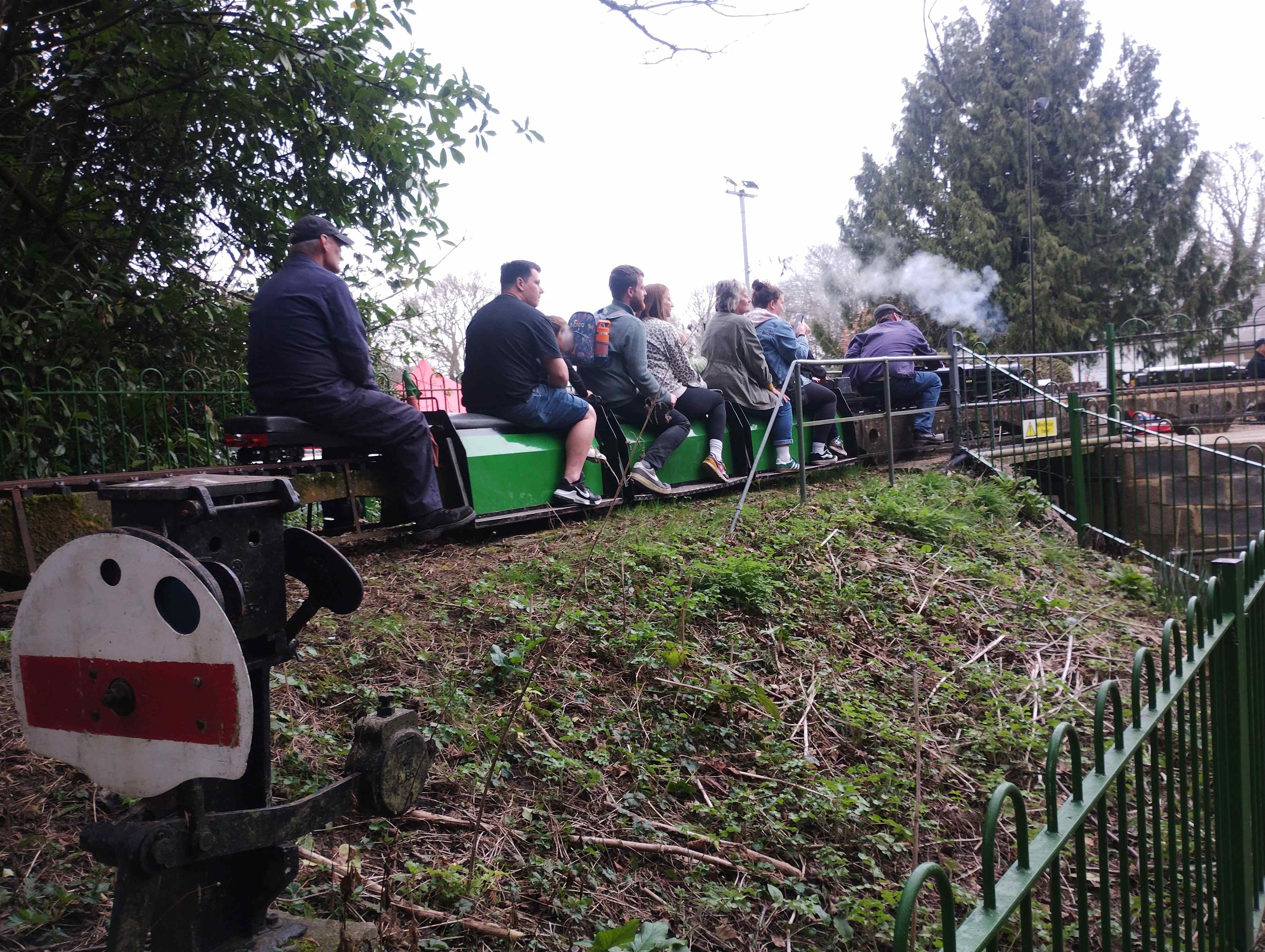 Photo of 3 coach passenger train crossing the entrance